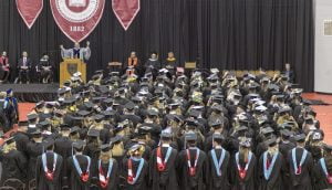 Photo of graduating students in an arena.
