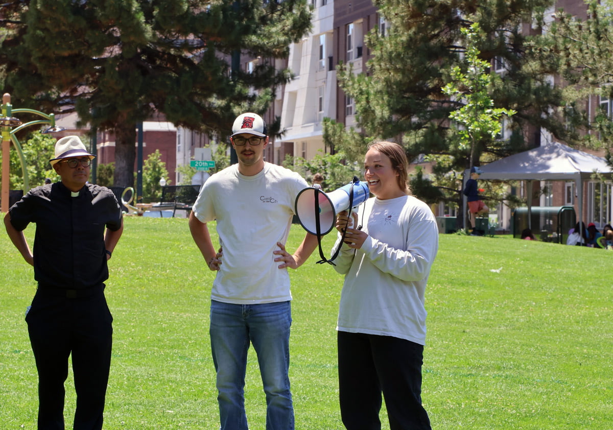 Vince Byrne (center) helping gather community members in downtown Denver for lunch in the park with Christ In City.