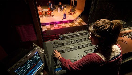 Student working in the control room at Scott Studio Theatre