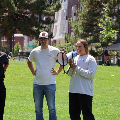 Vince Byrne (center) helping gather community members in downtown Denver for lunch in the park with Christ In City.
